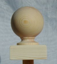 Ball newel cap in pine, on square base.